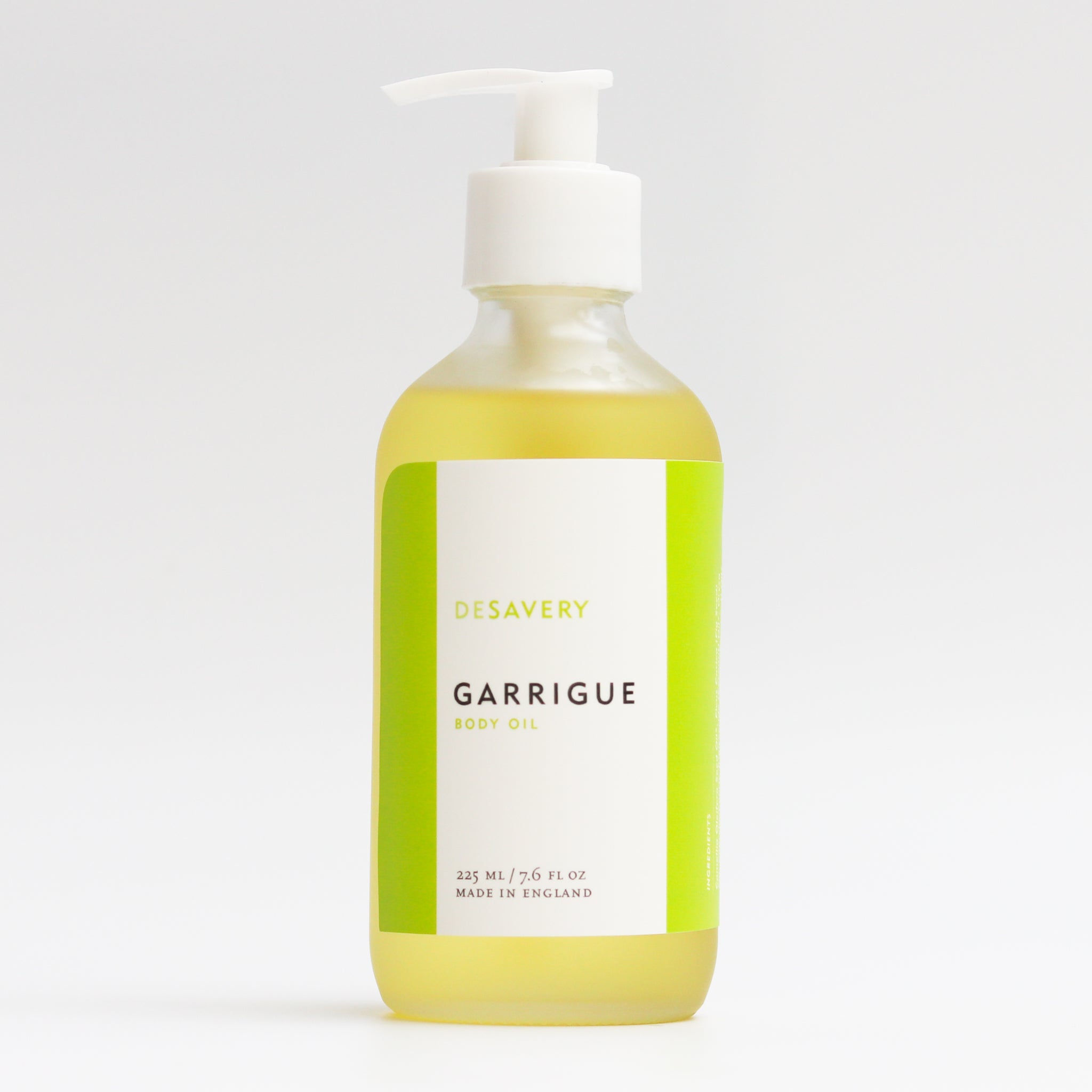 Garrigue Body Oil, 225 ml in glass bottle with white treatment pump that can be locked. The ingredients are organic and vegan. Made with fig seed oil, camellia seed oil, juniper and cypress. 